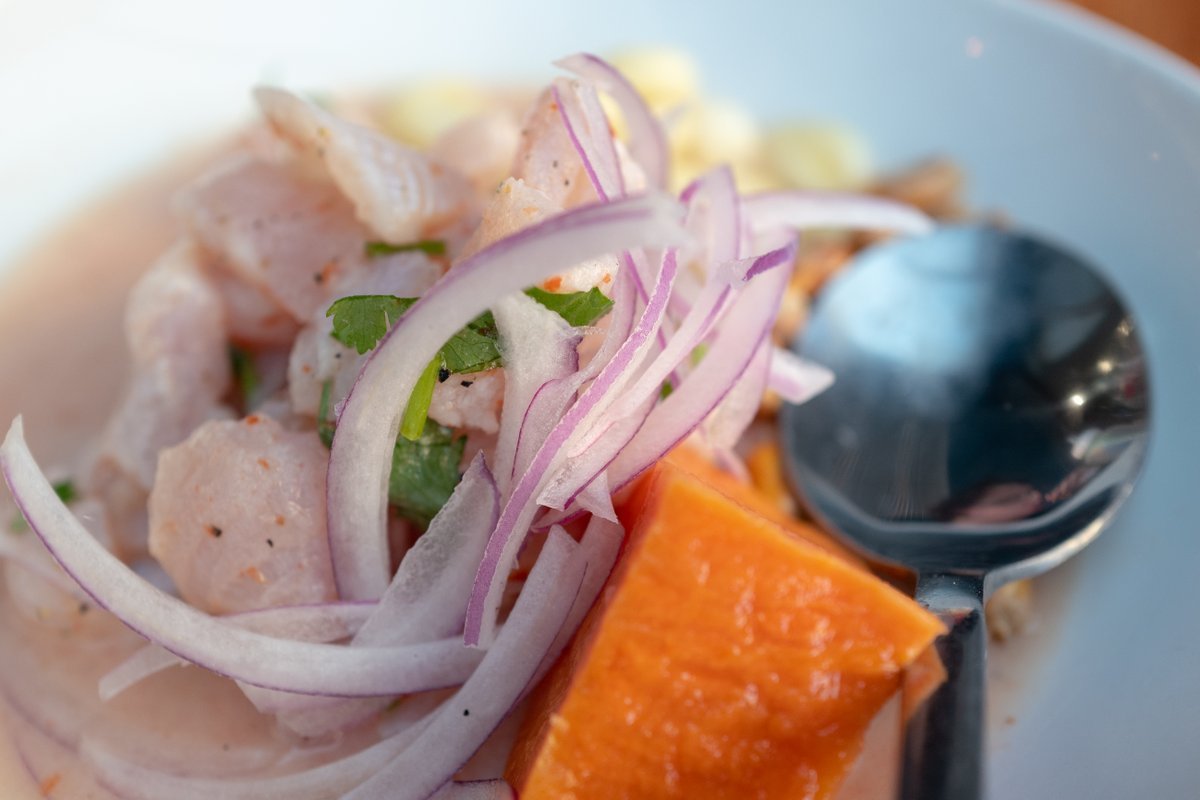 Close-up of the Peruvian dish cebiche pescado with fresh fish and shaved onions at the Parada Kitchen Peruvian Restaurant in Walnut Creek, California, February, 2021.