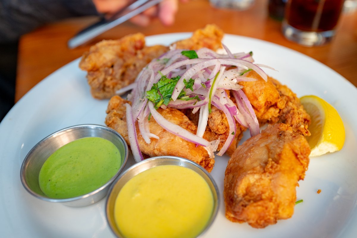 Close-up of the Peruvian dish chicharrones, with huancaina and chimichurri sauces, at the Parada Kitchen Peruvian Restaurant in Walnut Creek, California, February, 2021.