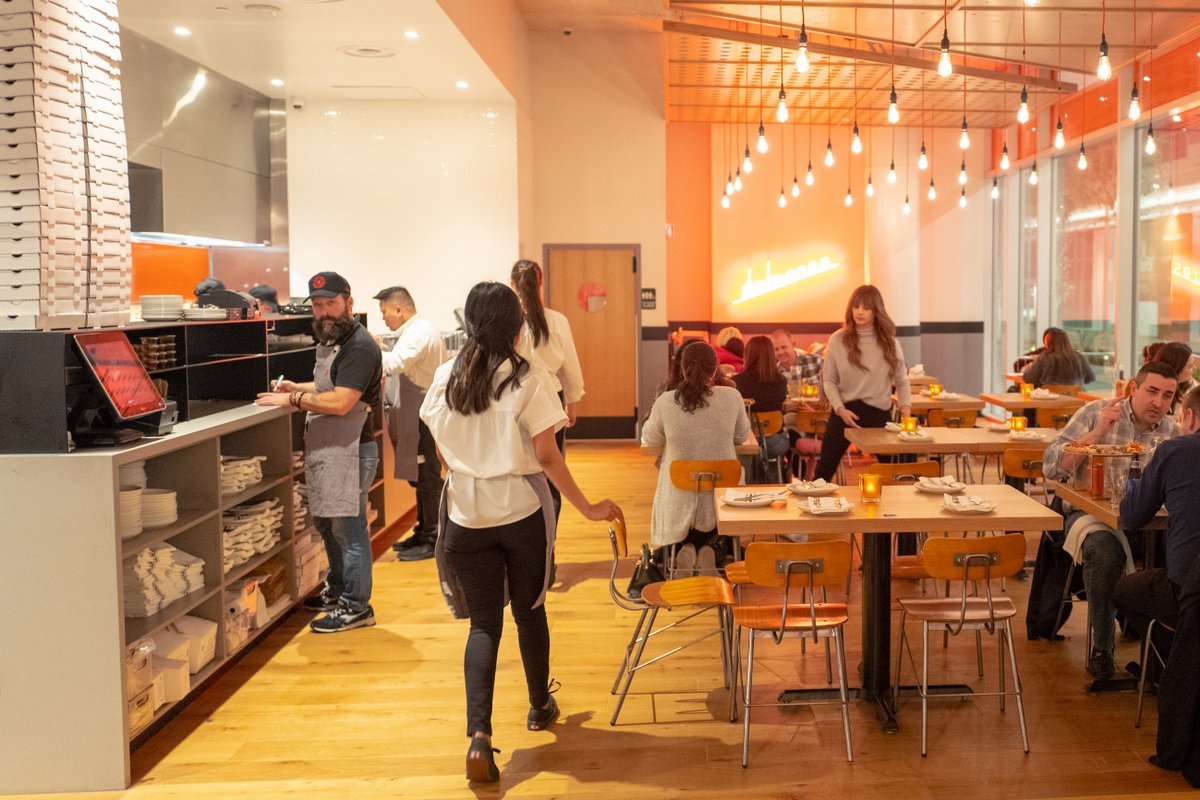 Interior of restaurant during grand opening event at Delarosa restaurant in City Center Bishop Ranch shopping center in San Ramon, California, November 20, 2019. Delarosa is an example of the trend towards iconic San Francisco restaurants opening locations in the affluent East Bay.