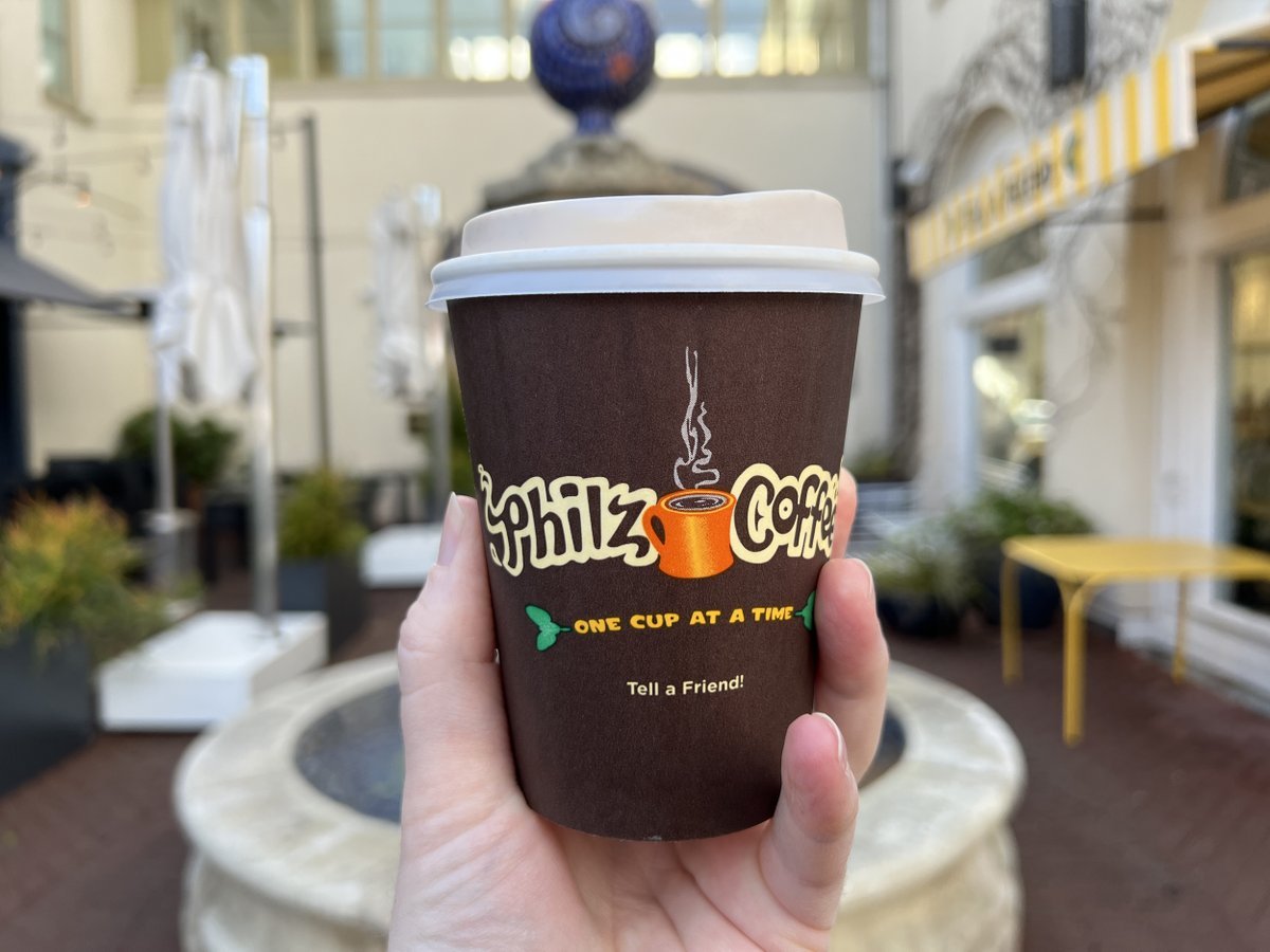 Close-up of a persons hand holding a container of Philz brand coffee in Lafayette, California, January 8, 2023.