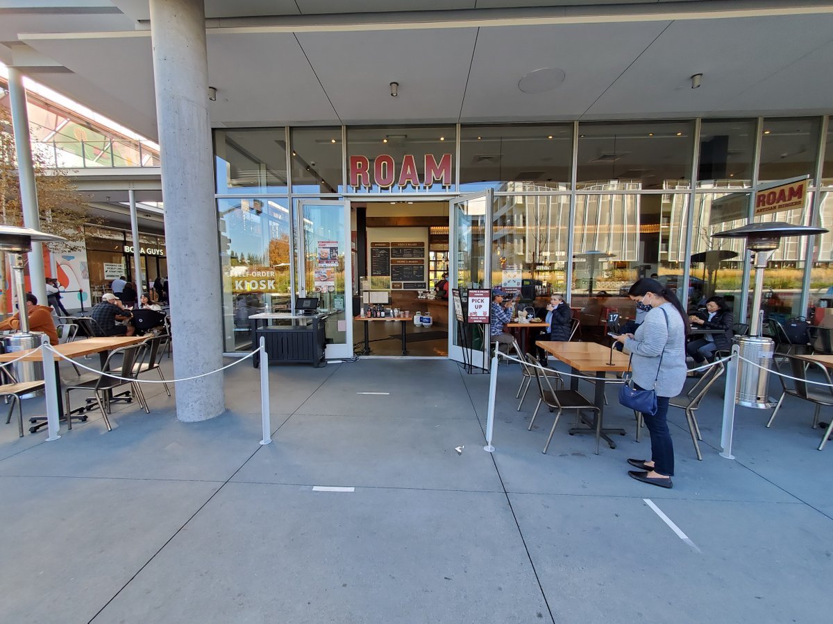 Front view of the entrance to the Roam Artisan Burgers restaurant with an outdoor seating area in San Ramon, California, November 28, 2020.